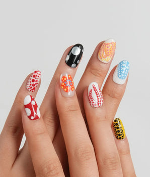 Kusama Dot short oval nail set with red, blue, yellow, black, pink and gold dots
