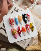 Kusama Dot medium stiletto press-on nails with bold multicolor dot design