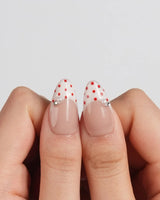 Ladybug Picnic press-on nails in short almond shape — Vintage Red Polka Dots, Hand-painted Ladybugs & French Pearl Accents.