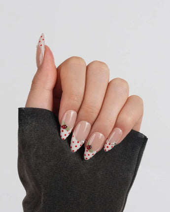 Ladybug Picnic press-on nails in short almond shape — Vintage Red Polka Dots, Hand-painted Ladybugs & French Pearl Accents.