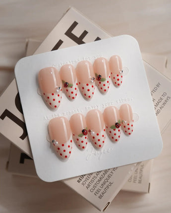 Ladybug Picnic nail art close-up showing Vintage Red Polka Dots, Hand-painted Ladybugs & French Pearl Accents. details
