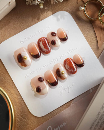 Latte Coffee press-on nails with glossy latte marble, creamy foam details and coffee bean accents