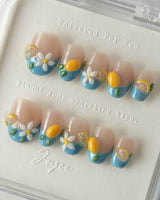 Lemon Grove press-on nails in extra short oval shape — Blue French, 3D Lemon & Florals.