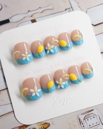 Lemon Grove press-on nails in extra short squoval shape — Blue French, 3D Lemon & Florals.