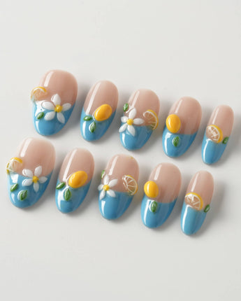 Lemon Grove press-on nails in medium oval shape — Blue French, 3D Lemon & Florals.