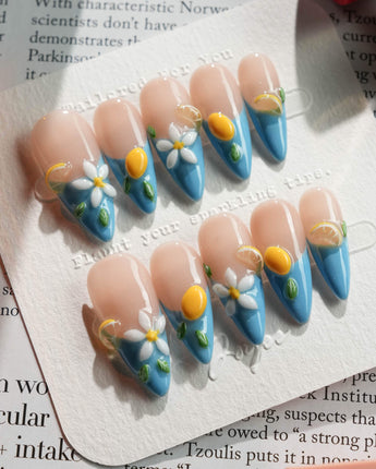 Lemon Grove press-on nails in medium stiletto shape — Blue French, 3D Lemon & Florals.