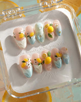 Lemon Shore nude and aqua blue press-on nails with 3D lemons and white blossoms