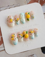 Lemon Shore Mediterranean inspired press-on nails with lemon and floral texture