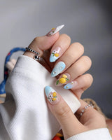 Lemon Shore coastal citrus nail set with aqua blue waves, lemons and flowers