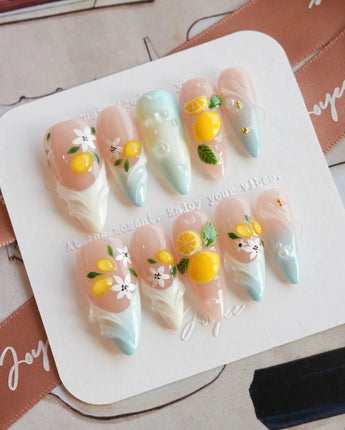 Lemon Shore summer citrus nail set in nude, yellow and aqua blue tones