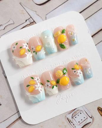 Lemon Shore handmade summer nails with aqua blue accents and lemon blossoms