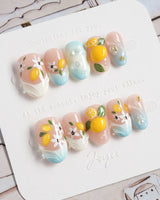 Lemon Shore press-on nails with dimensional lemons and delicate white flowers