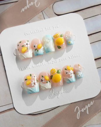 Lemon Shore nude aqua press-on nails with sculpted citrus and floral details