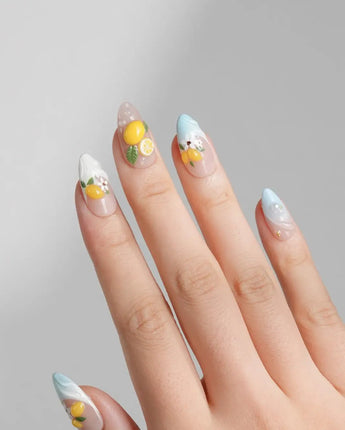 Lemon Shore short almond press-on nails with nude base and sculpted lemons