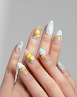 Lemon Shore short almond press-on nails with Amalfi lemon and floral accents