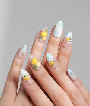Lemon Shore short almond press-on nails with Amalfi lemon and floral accents
