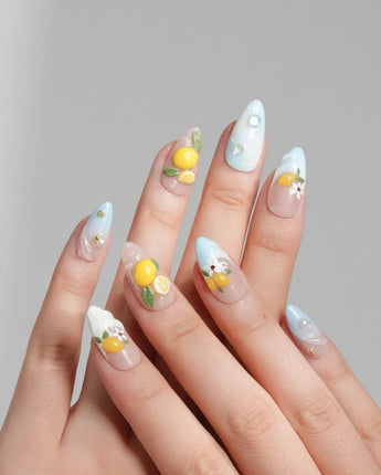 Lemon Shore short almond press-on nails with Amalfi lemon and floral accents
