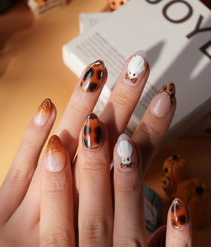 Leopard Boo press on nails with ghosts wearing leopard bows, amber tortoiseshell with gold chrome and leopard print French tips - image 2