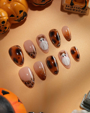 Leopard Boo press on nails with ghosts wearing leopard bows, amber tortoiseshell with gold chrome and leopard print French tips - image 1