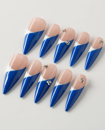 Light blue French tip nails with a soft pastel base and crisp white tips.