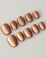 Light Brown Color Cat-eye Nails press-on nails in extra short oval shape — light brown cat eye