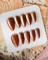 Light Brown Color Cat-eye Nails press-on nails in medium almond shape — light brown cat eye