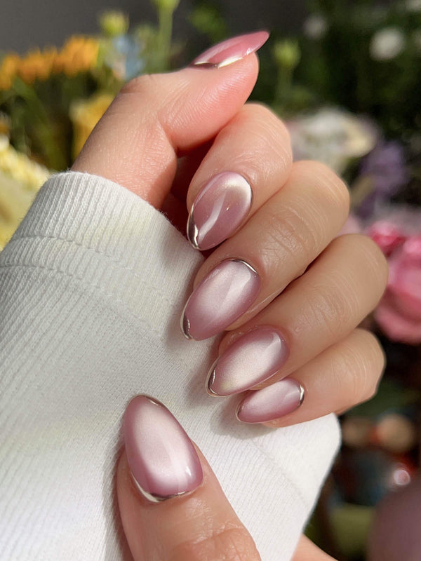 Light pink cat eye press on nails for a soft and elegant style
