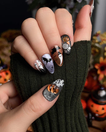 Lights Out press-on nails in short almond shape — Glitter Halloween, 3D Pumpkin & Cross.