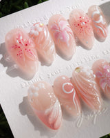 Lily-Nocturne nail art close-up showing Soft Peach Pink, 3D Lilies & Shell Textures. details