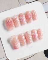 Lily-Nocturne press-on nails in short coffin shape — Soft Peach Pink, 3D Lilies & Shell Textures.