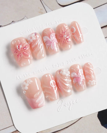 Lily-Nocturne press-on nails in short coffin shape — Soft Peach Pink, 3D Lilies & Shell Textures.
