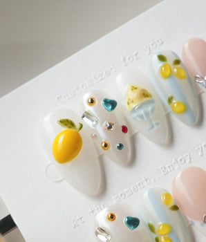 Limoncello Italian lemon press-on nails with tiny silver bows and ring charms