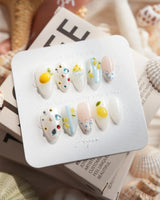Limoncello Italian lemon press-on nails in extra short almond shape