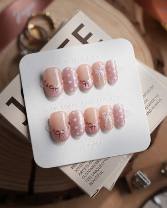 Love Letter press-on nails in short oval shape — Dreamy Shimmer Pink, 3D Metallic Bows, White Hearts & Hand-painted Ribbons.