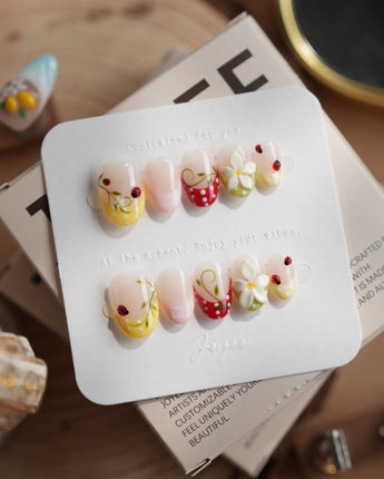 Lucky Dot press-on nails in extra short oval shape — Cute Pastoral, Hand-painted Ladybugs & Red Polka Dot French Tips.
