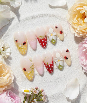 Lucky Dot handmade press-on nails featuring Cute Pastoral, Hand-painted Ladybugs & Red Polka Dot French Tips.