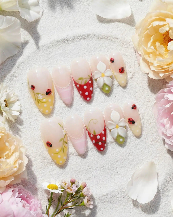 Lucky Dot handmade press-on nails featuring Cute Pastoral, Hand-painted Ladybugs & Red Polka Dot French Tips.