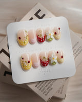 Lucky Dot press-on nails in short oval shape — Cute Pastoral, Hand-painted Ladybugs & Red Polka Dot French Tips.
