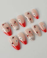 Lucky you handmade press-on nails featuring Red French, Daisy & Ladybug.