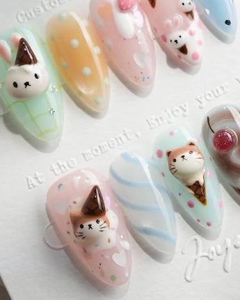 Lulu's Cone short almond nails with sculpted Lulu cat face and pastel cone charms