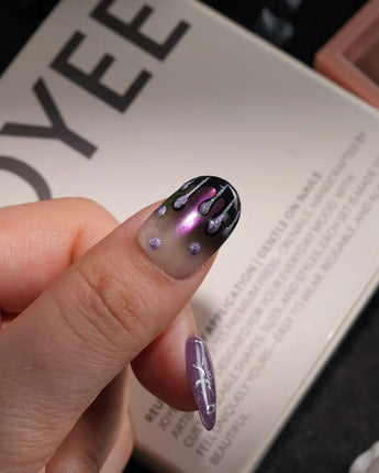 Luminous Spider handmade press-on nails in short oval shape by Joyee Nails