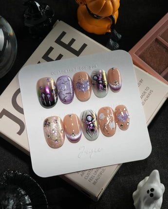 Luminous Spider handmade press-on nails in short oval shape by Joyee Nails