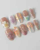 Wonderland Whims luxury floral press-on nails with sculpted blossoms and delicate pearls