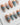 Monet sunrise press on nails hand-painted in blue with a red sun and gold frames