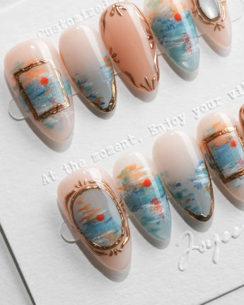Monet sunrise press on nails hand-painted in blue with a red sun and gold frames