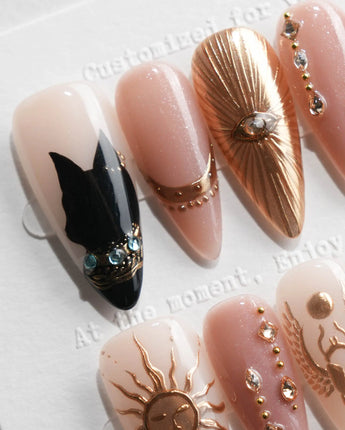 Egyptian Gold press on nails with 3D gold sun, scarab and ankh on nude base