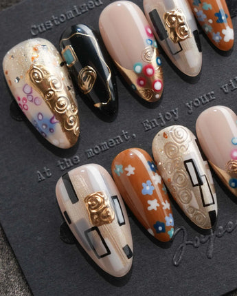 Golden Kiss press on nails with raised gold spirals and flowers, inspired by Klimt