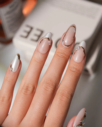 Baroque pearl press on nails with molten gold and real pearls on a nude base