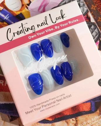 Majorelle Blue glossy summer nails with carved gel lines and oasis-blue shine