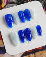 Majorelle Blue close-up of vibrant blue nail art with raised gel lines and pearls
